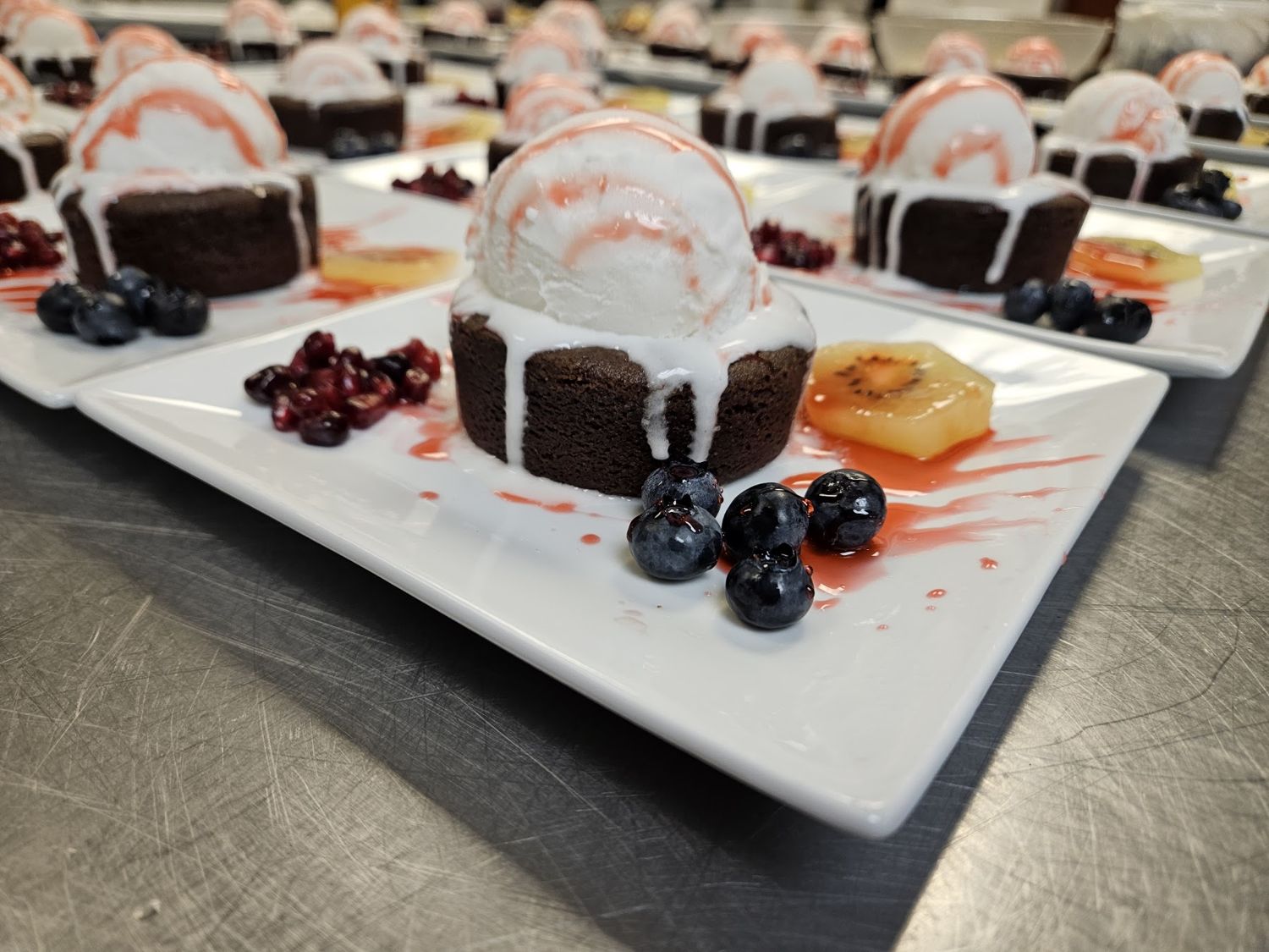 Plated chocolate lava cakes with berries